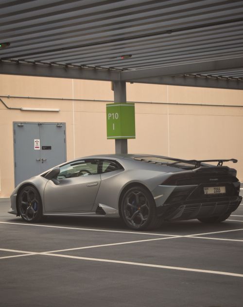 Free A stylish gray Lamborghini Huracan parked in an urban covered parking space. Stock Photo