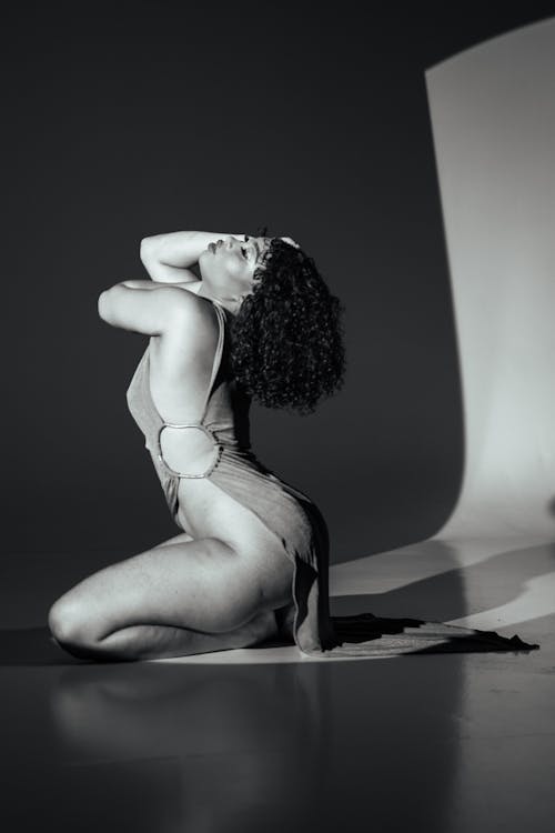 Sexy Black Woman in Dress Posing in Studio