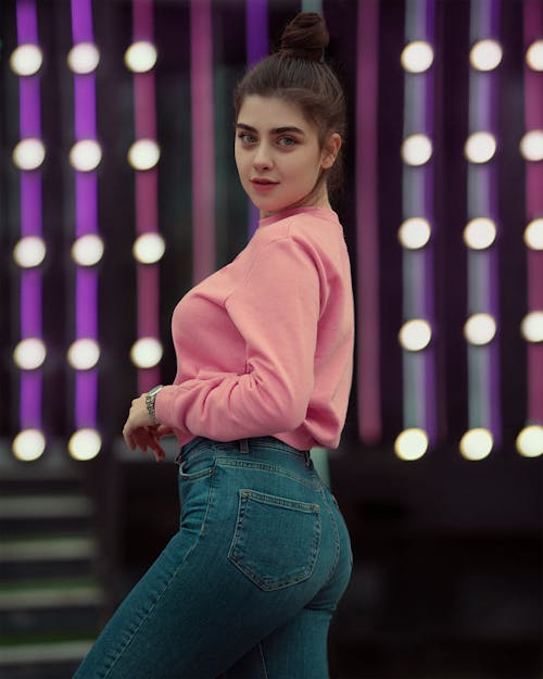 A Woman in Pink Sweater Posing