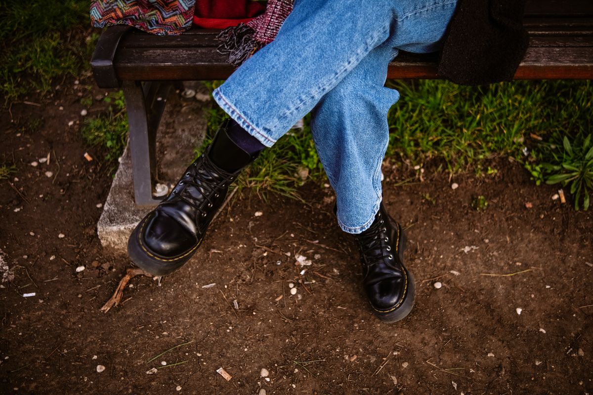 Black boots paired with blue jeans, a classic boot socks with denim look