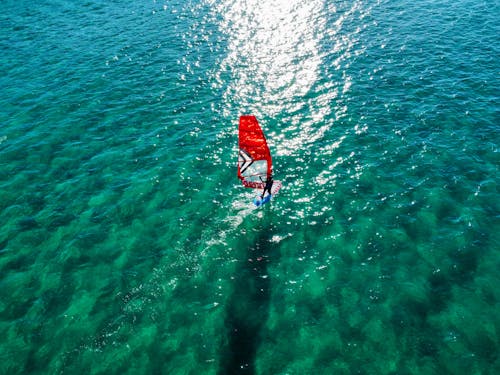 Man Windsurfing on Sea
