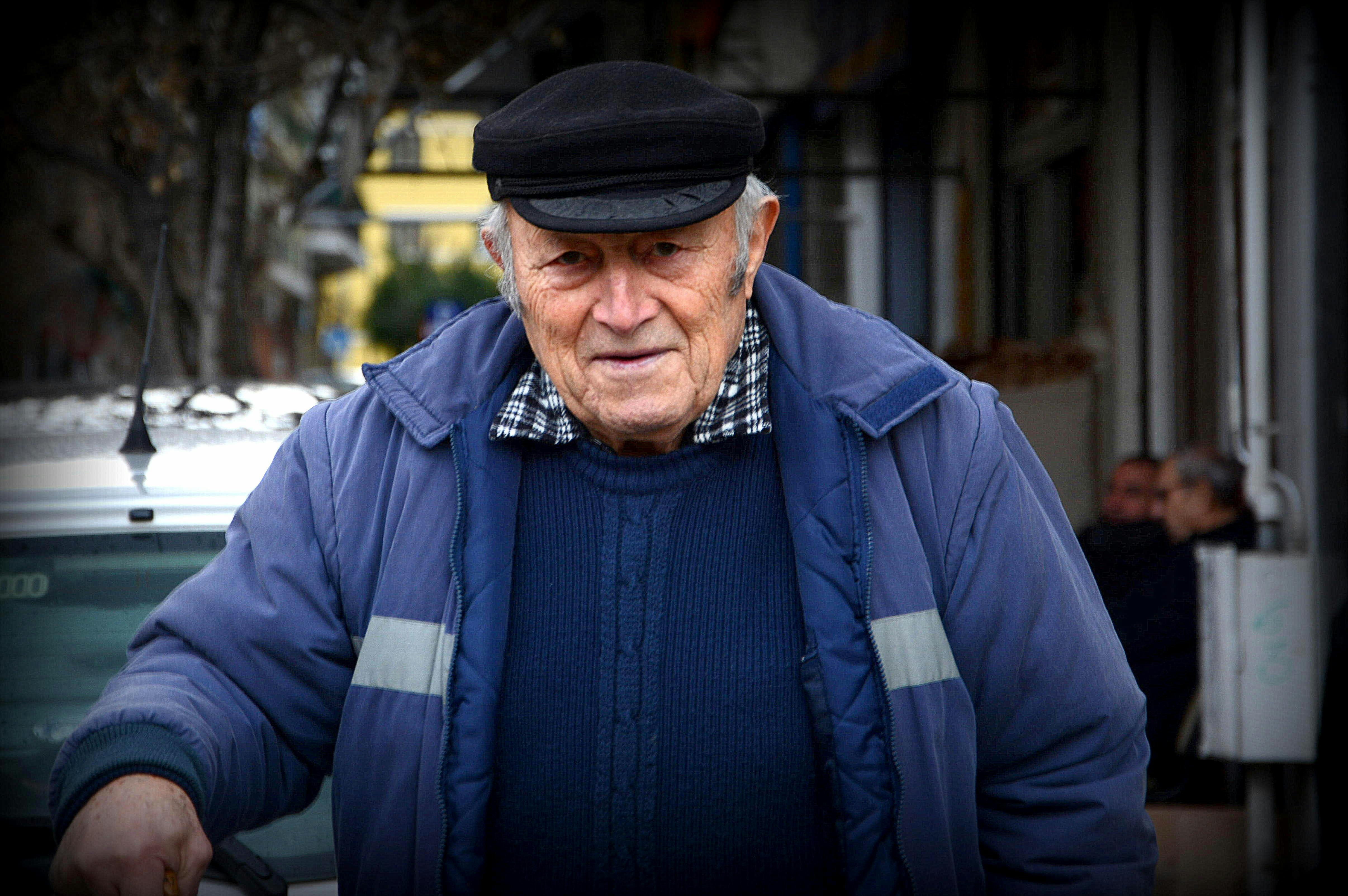 Portrait Of The Grey-haired Elderly Man In A Beige Jacket In Village On The  Nature Stock Photo, Picture and Royalty Free Image. Image 6777131.