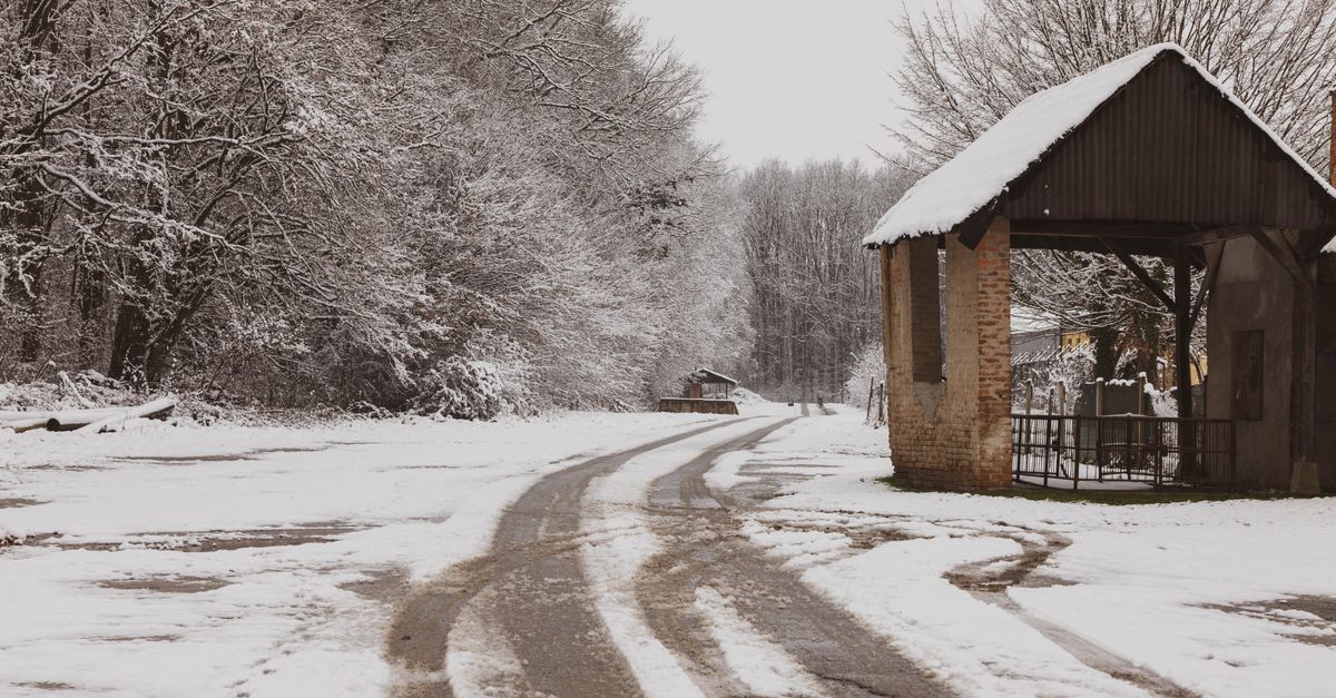 A snow-covered country road in winter, the year-round access question lenders ask about a Simcoe County cottage