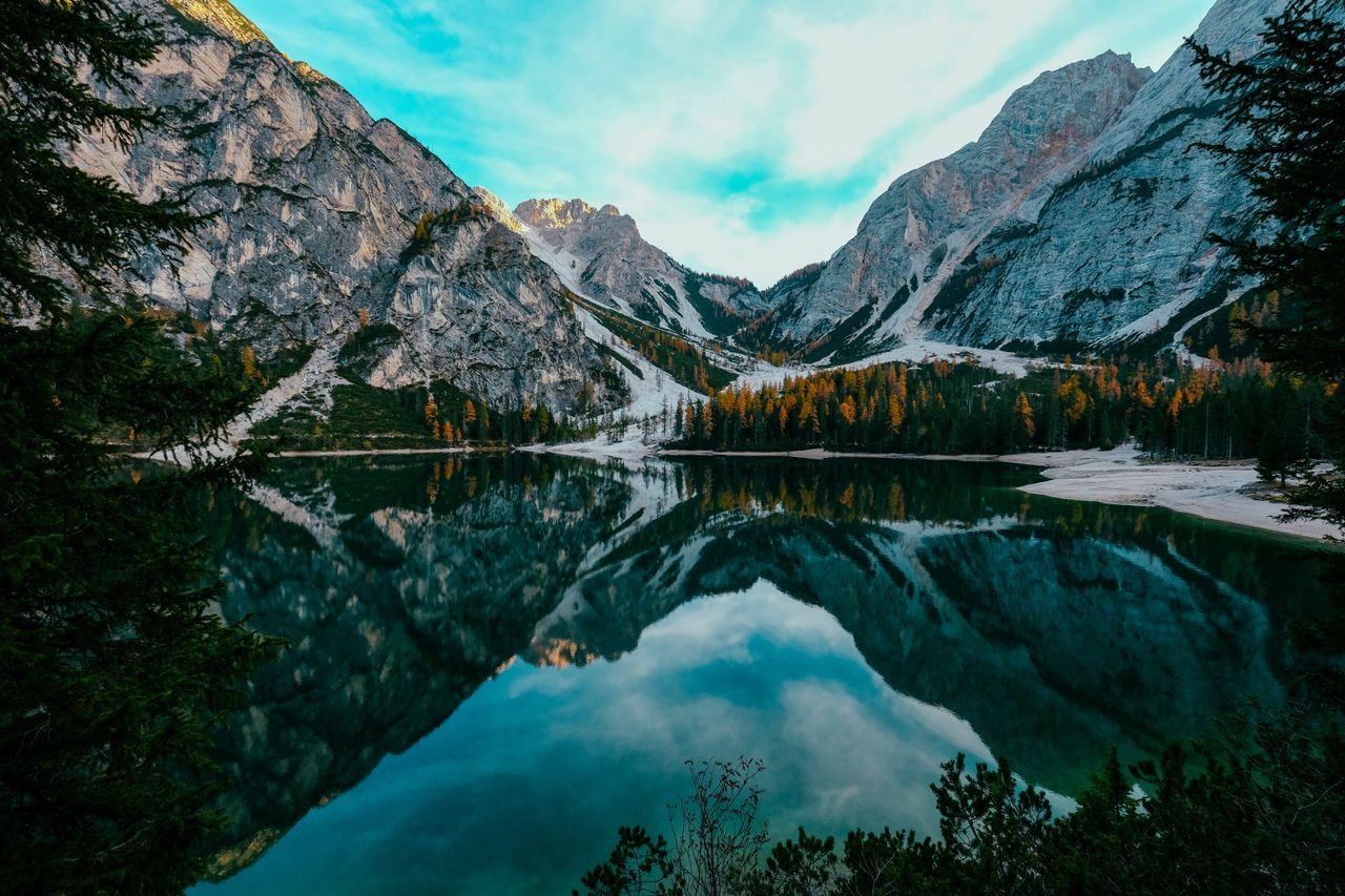 stunning mountain lake landscape with crisp reflections and autumn col