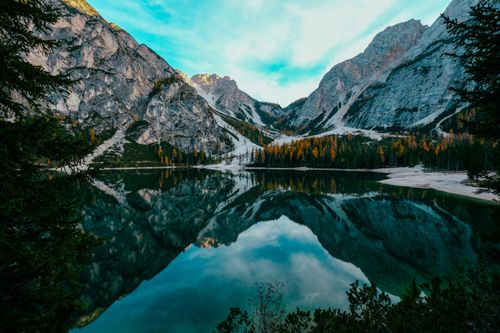 Free Stunning mountain lake landscape with crisp reflections and autumn colors. Stock Photo