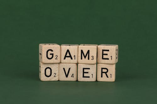 Close-up of Cubes with Letters Making a Text Saying "Game Over"