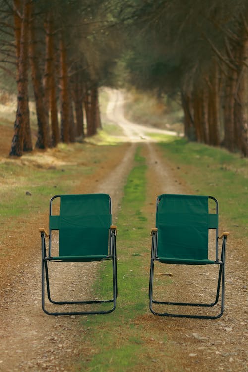 Two Chairs on a Dirt Road 