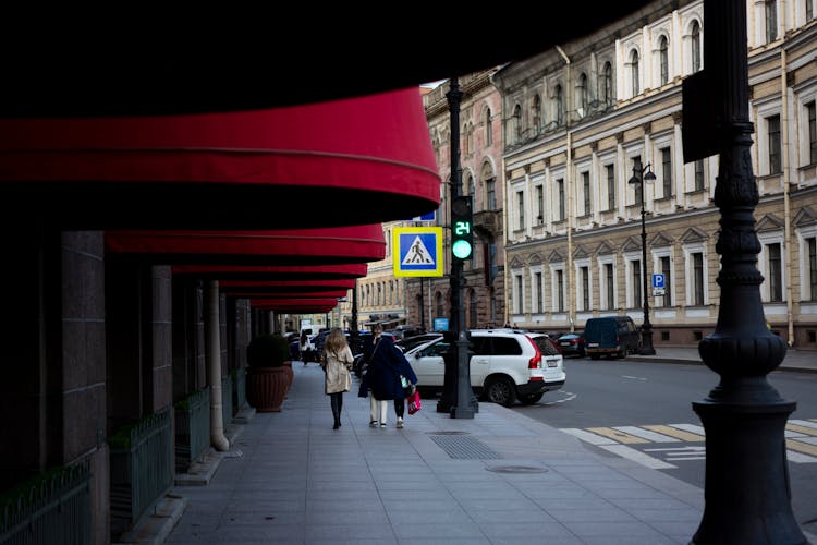 People Walking On The Sidewalk