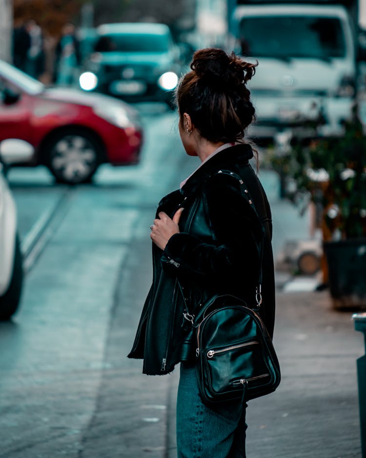 Woman Wearing Jacket Carrying A Bag