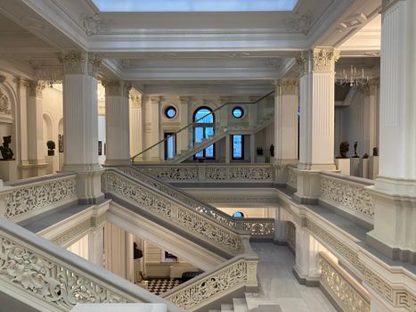 Luxurious stairway with ornate columns in Chișinău building.