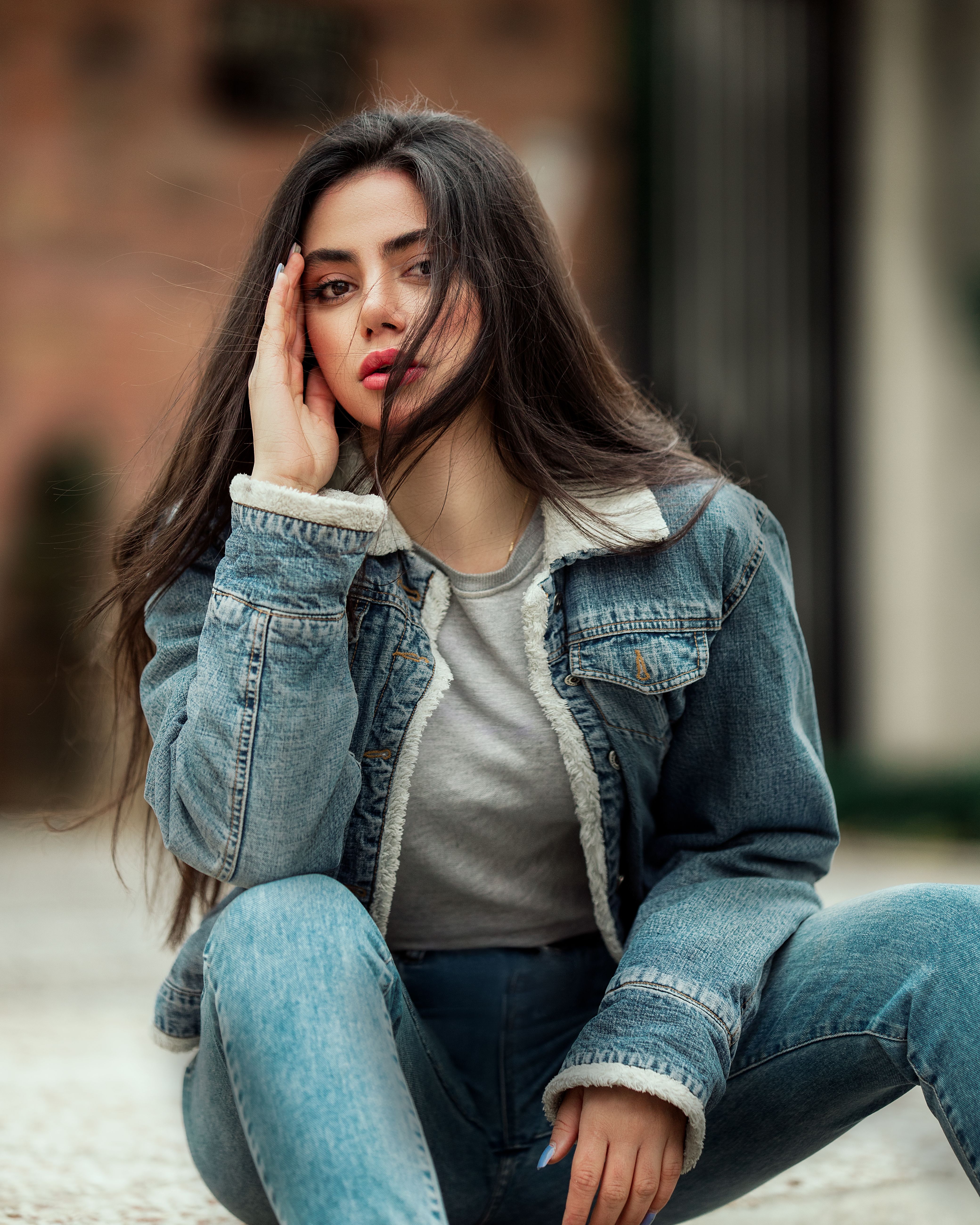Woman in denim dress with winter layers