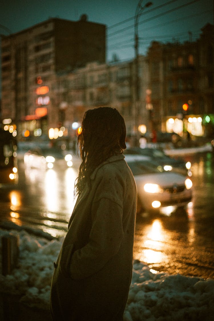 Woman Near Street In City In Winter