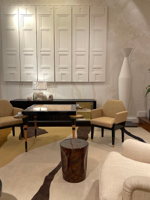 Elegant mid-century modern living room with beige furniture and retro decor.