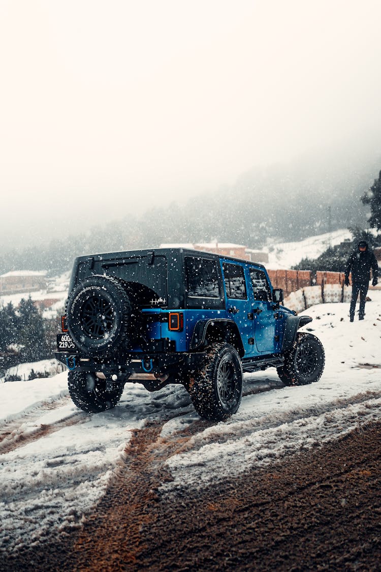 Off Road Car Standing On A Snowed Side Road