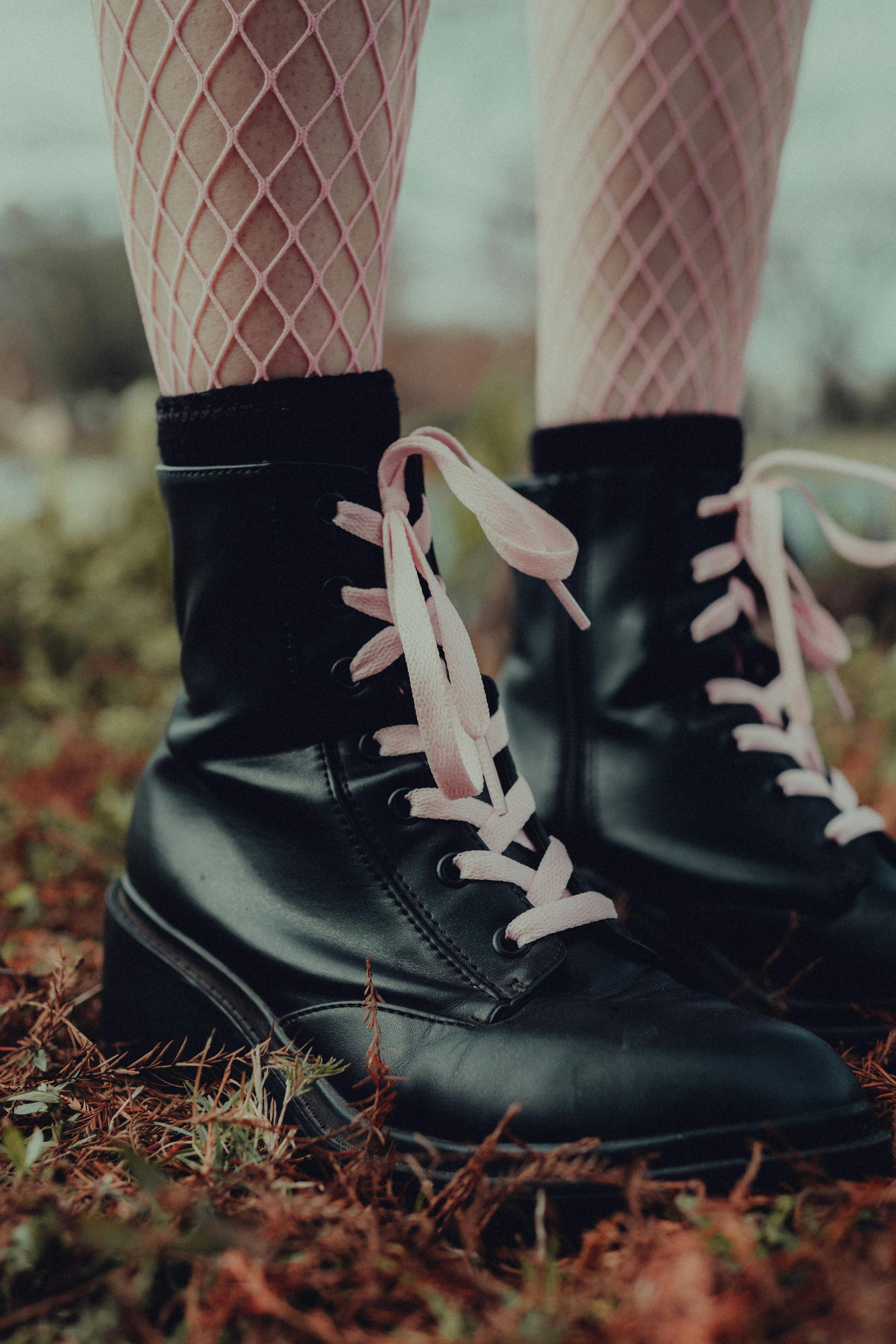 Pair of Black Lace-up Boots on Area Rug · Free Stock Photo