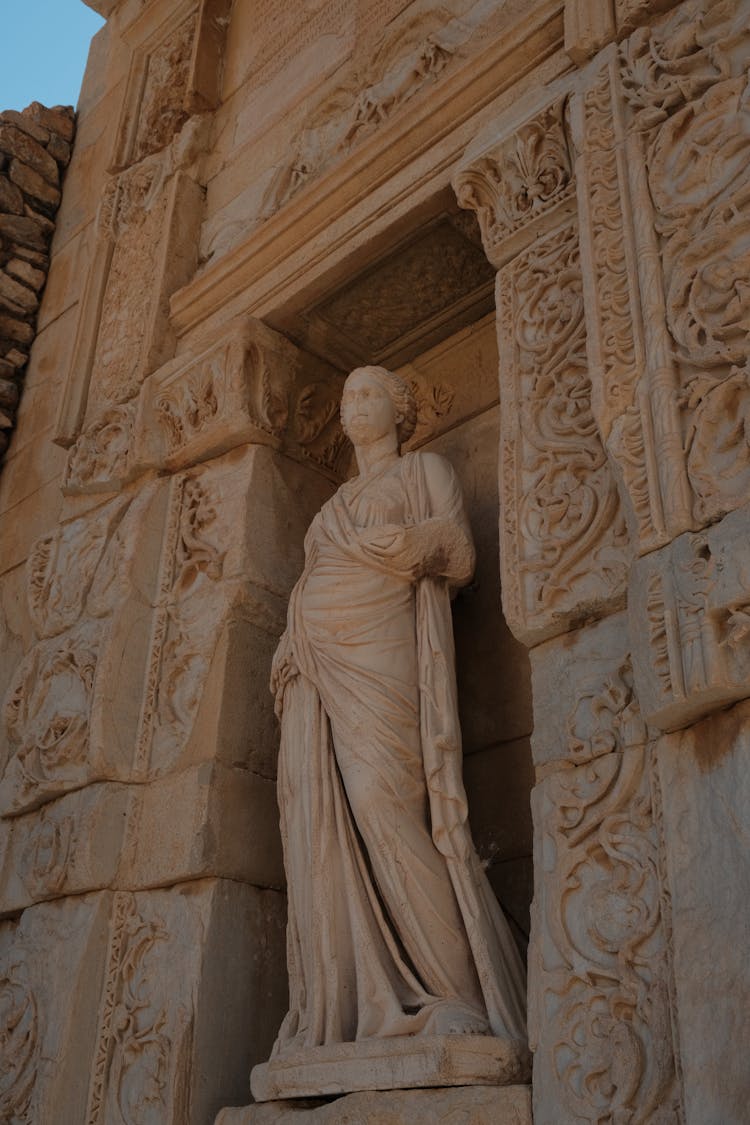 A Statue On Carved Wall 