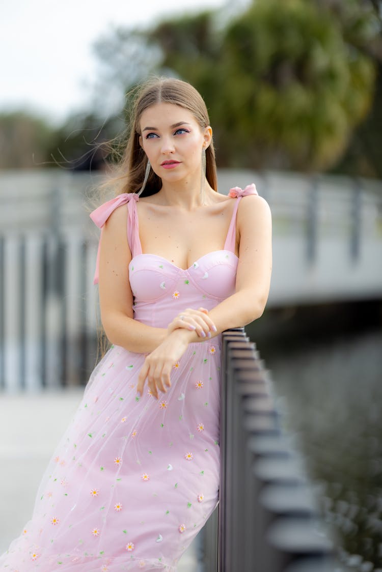 Young Beautiful Woman In A Pink Dress