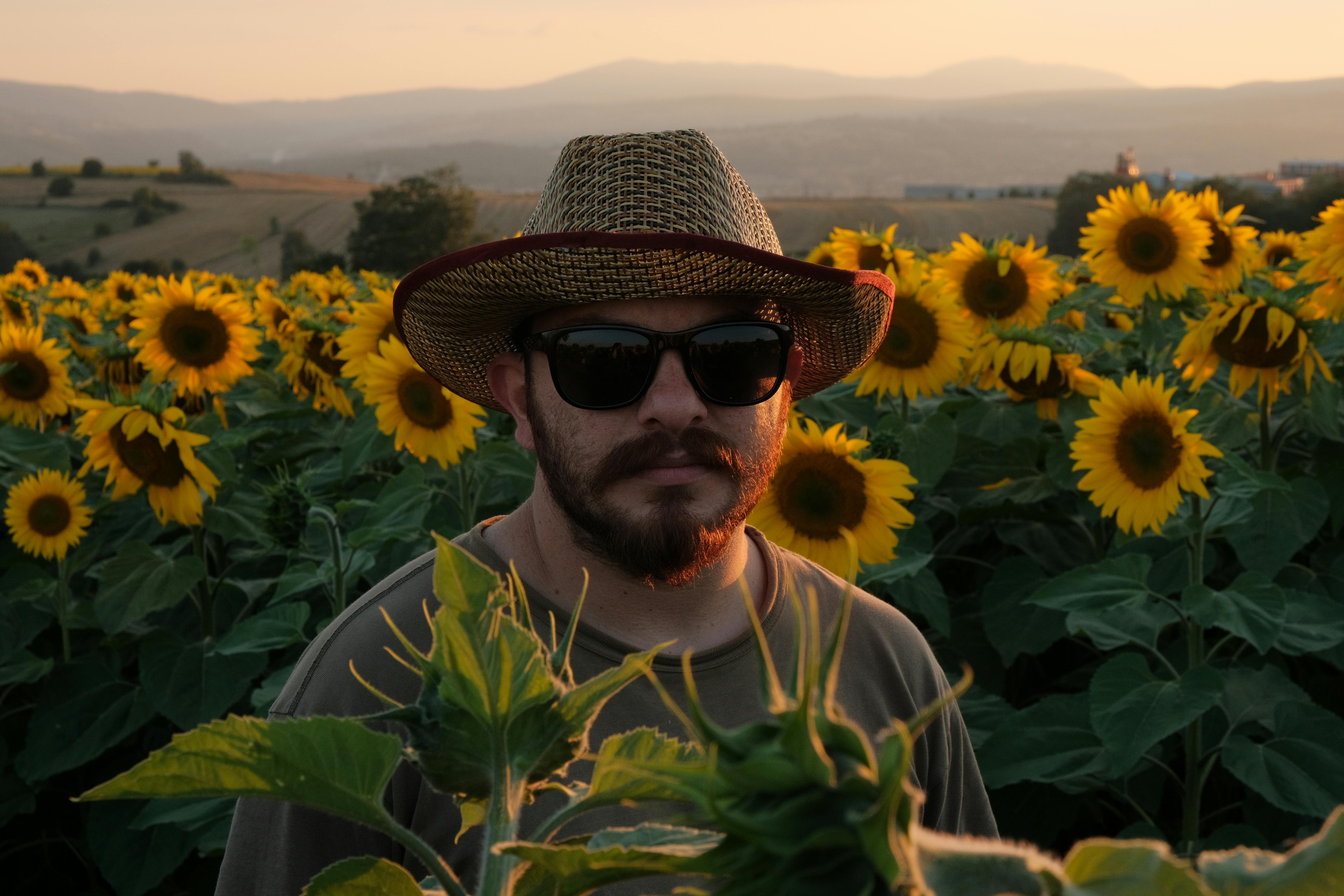 Woman Surrounded By Sunflowers · Free Stock Photo