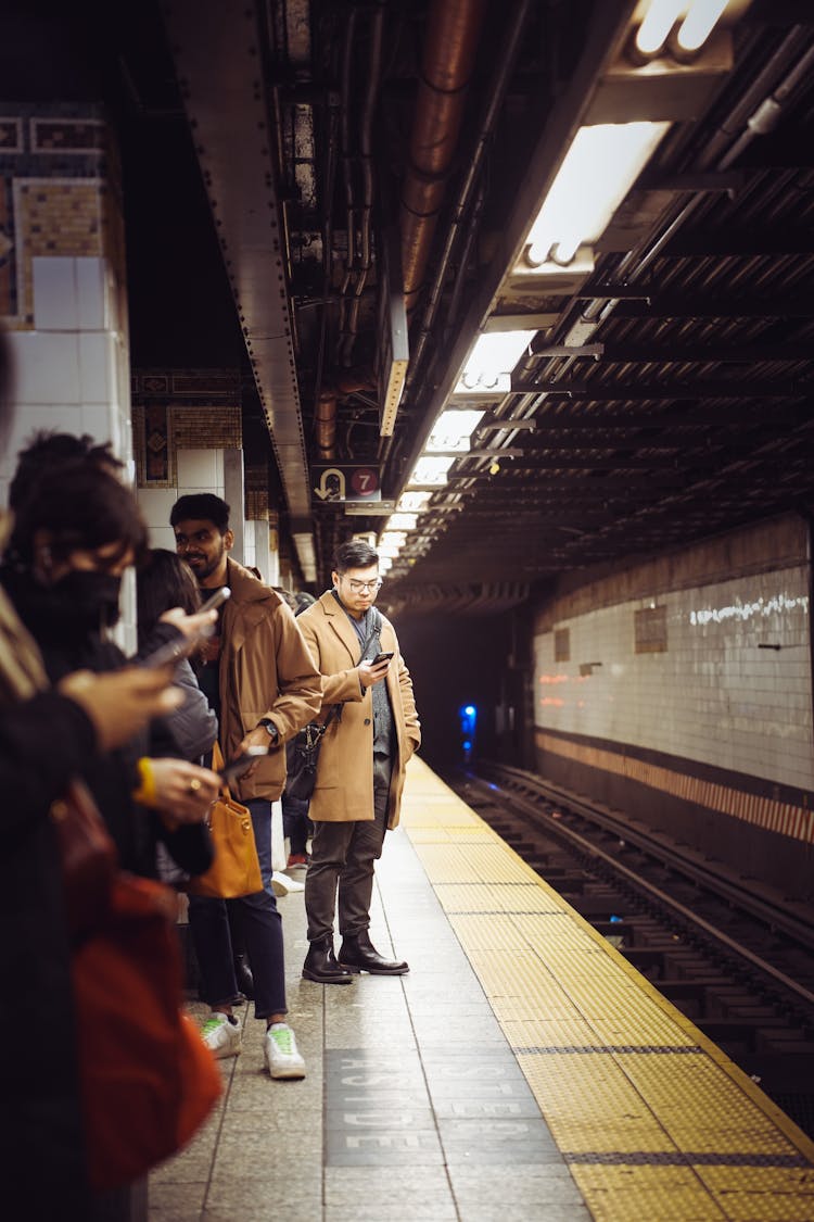 People Standing On Subway Platform