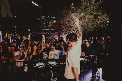 Disc Jockey Performing at a Street Party