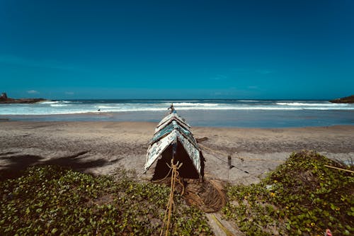 Free Broken Boat Docked on the Beach Stock Photo