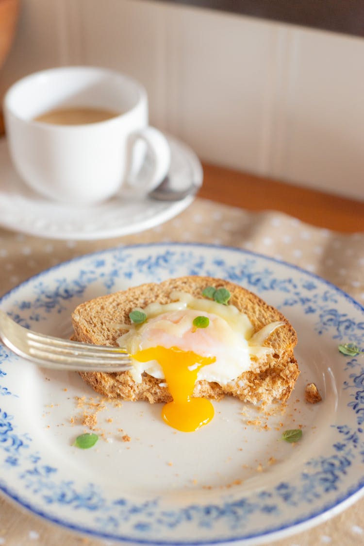 Tasty Egg Sandwich And Coffee On Table