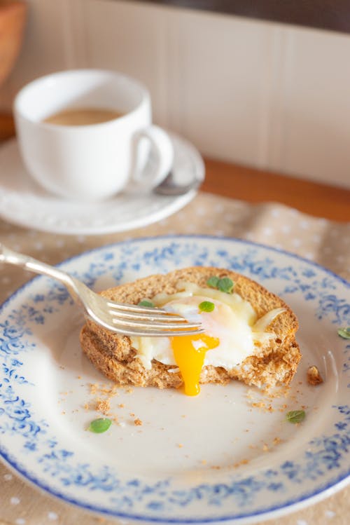 Delicious Egg Sandwich on Plate on Table