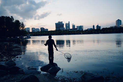 Kostenloses Stock Foto zu abend, fischer, fluss