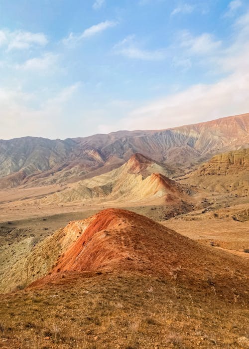Foto profissional grátis de areia, céu azul, colinas
