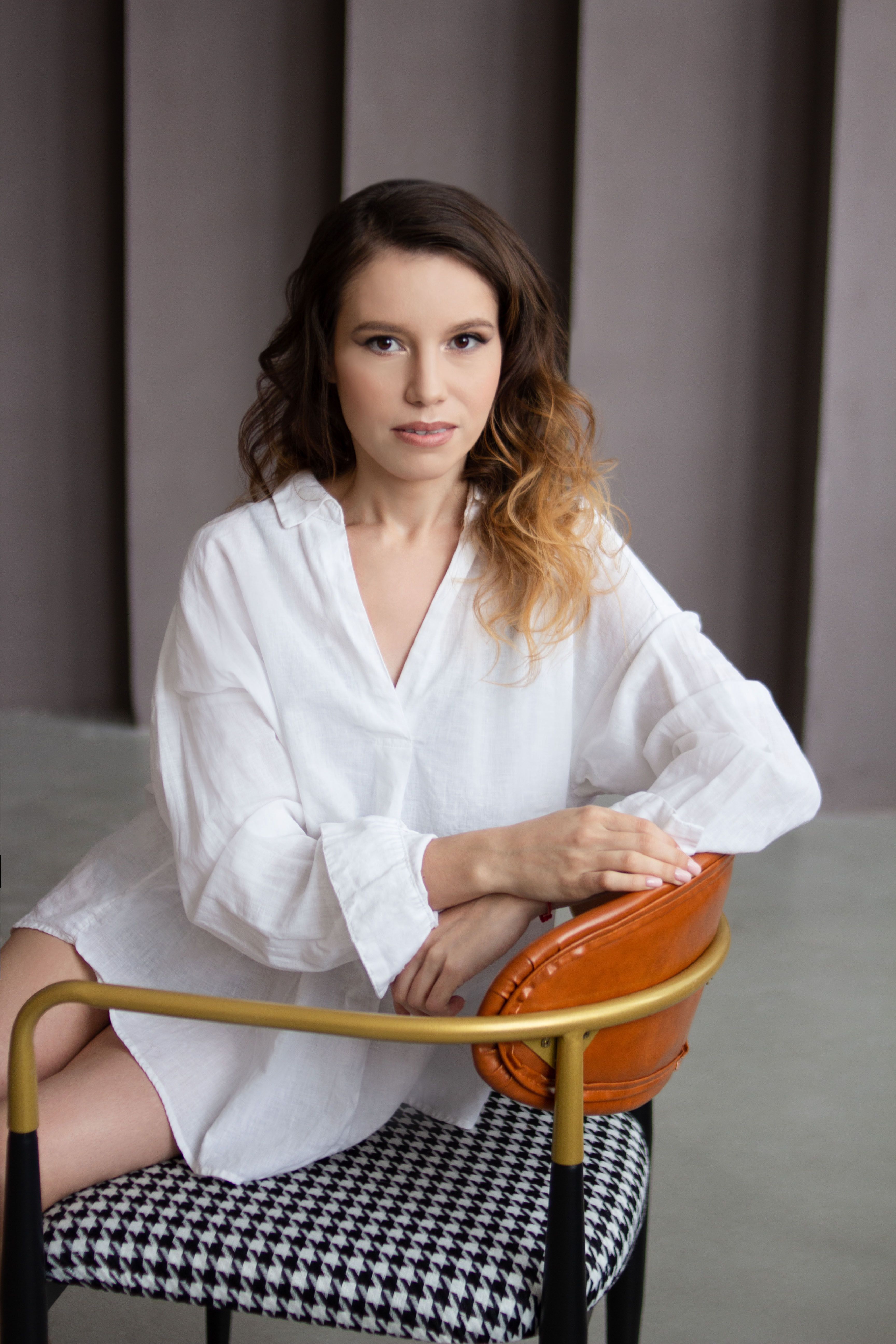 Woman Sitting on Design Chair · Free Stock Photo