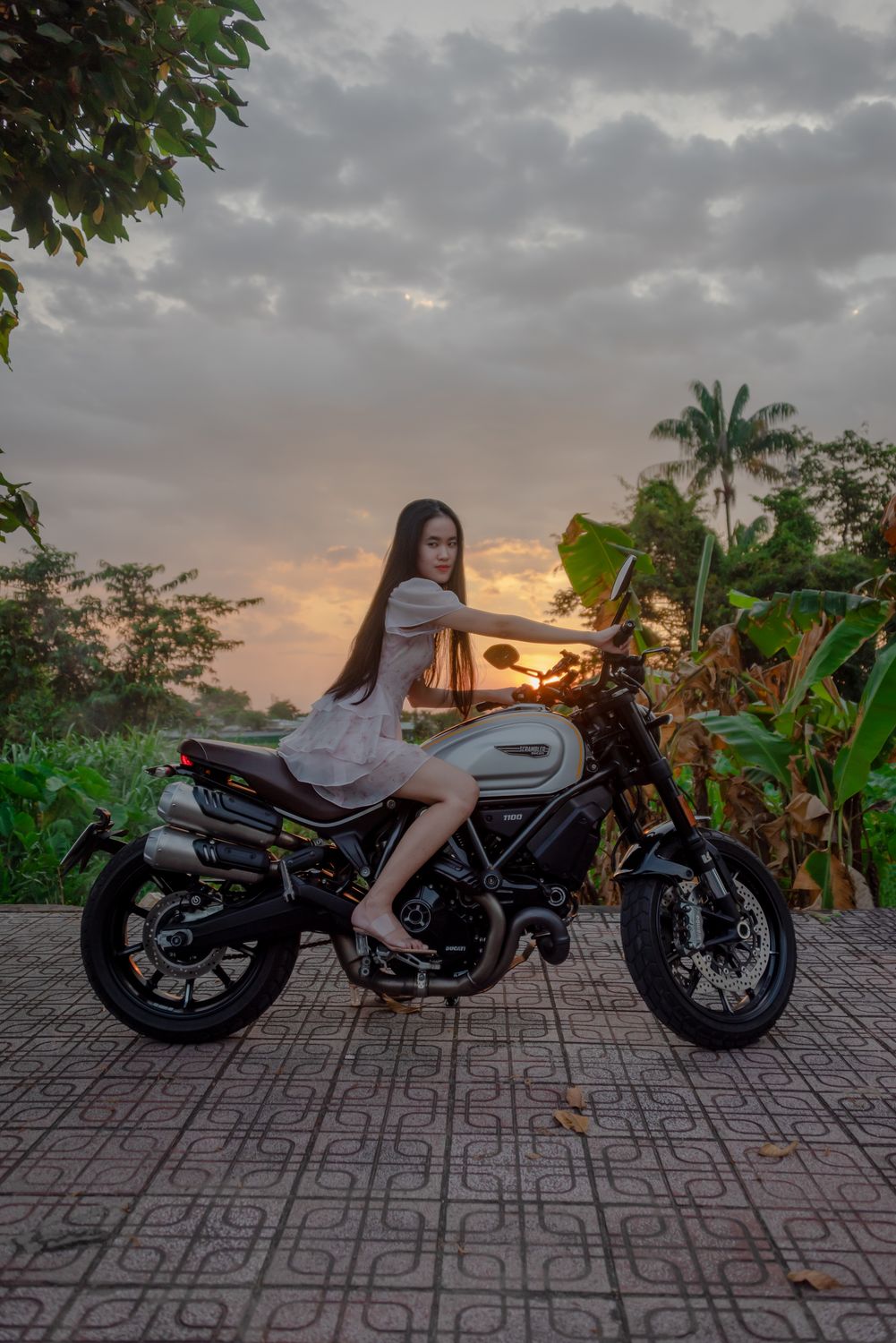 Photo of a Girl in a Dress Riding a Motorcycle · Free Stock Photo