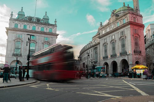 Long Exposure Photo of a Red Bus on a Street in Piccadilly Circus, London, England, UK 