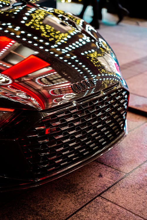 Close-up of an Audi R8 Reflecting the Lights on the Hood 