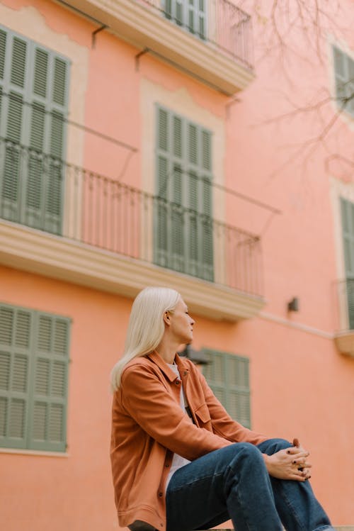 Woman Sitting on Street