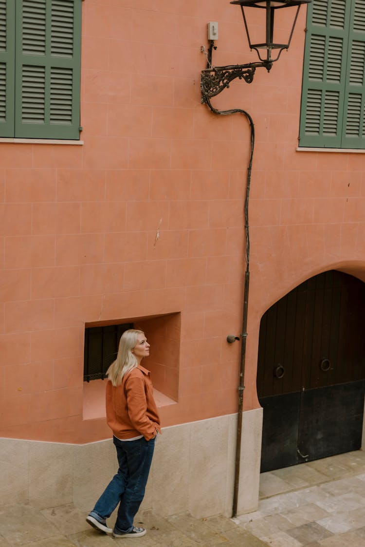 A Woman Walking While Looking Around