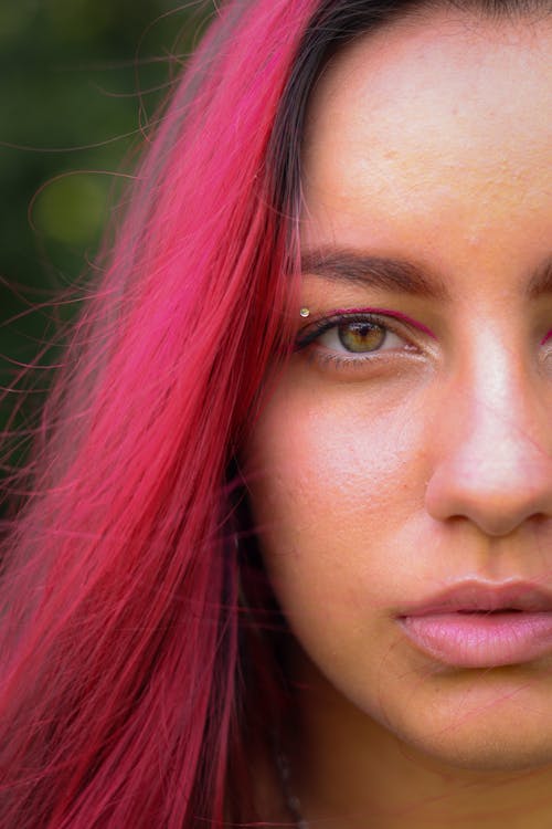 Free Close-up Portrait of a Young Woman with Pink Hair Stock Photo
