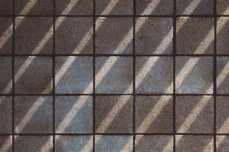Textured modern floor tiles in warm daylight