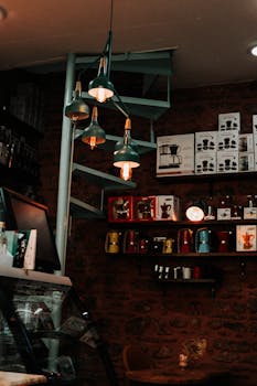 Warm interior of a Turkish café, featuring wooden shelves and vintage pendant lamps.