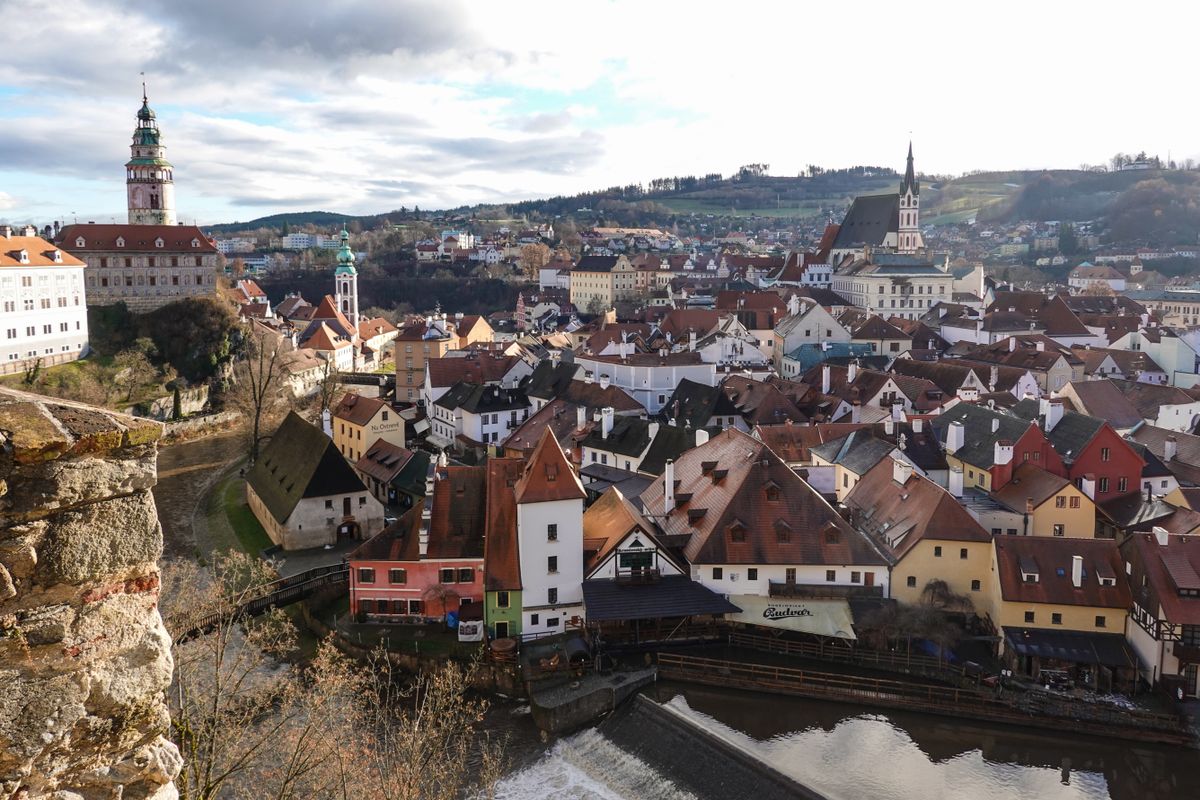 Aerial view of Cesky Krumlov castle and red rooftops above the river