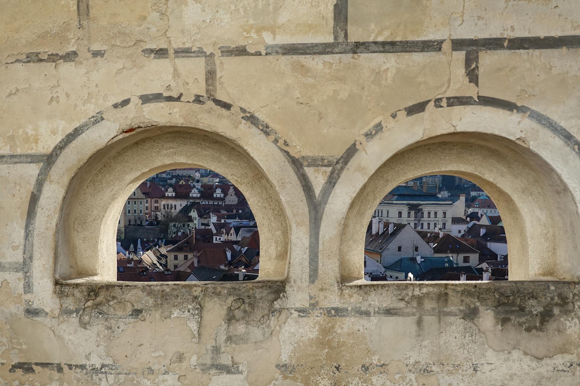 Old Town of Cesky Krumlov Seen through Openings in Wall