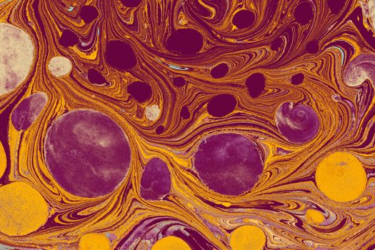 A colorful abstract artwork featuring marbled patterns with circular motifs in rich warm hues.