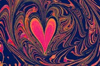 A heart shaped swirl pattern with blue and pink colors