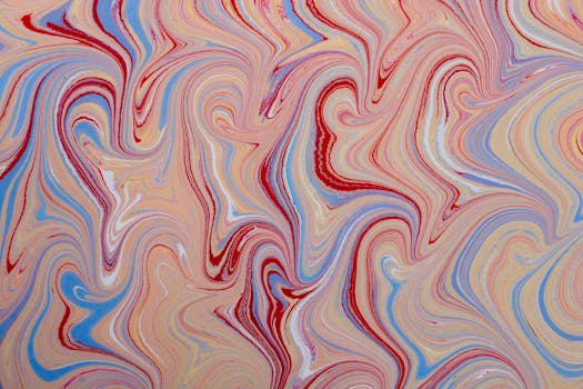 Vibrant abstract pattern with swirling marble effect in red, blue, and beige tones.