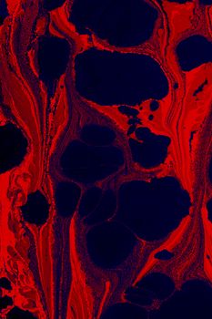 Dynamic red and black abstract texture resembling fluid patterns, perfect for artistic backgrounds.