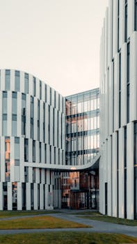 A sleek architectural shot of a modern office building with futuristic design elements.