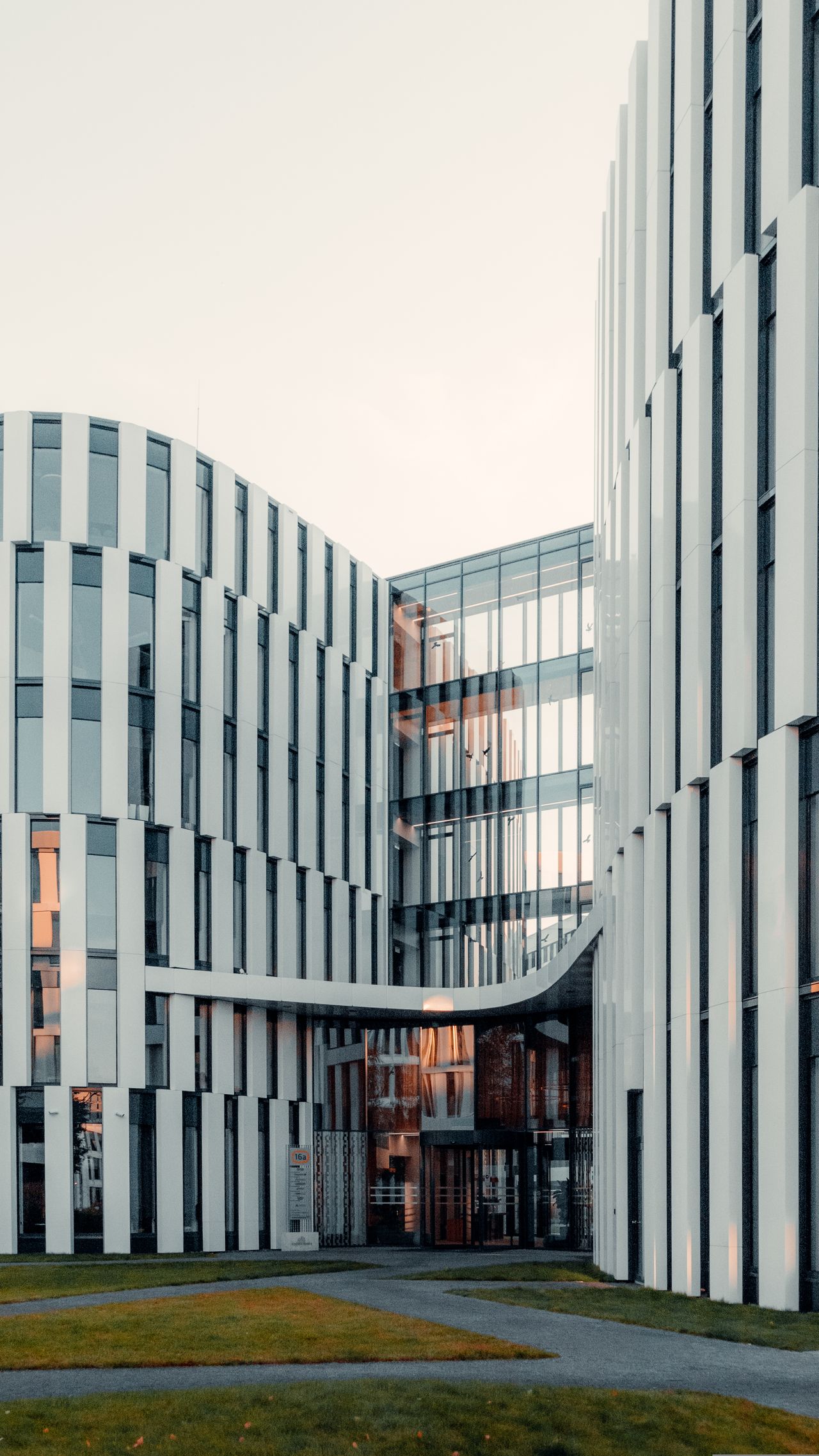 A sleek architectural shot of a modern office building with futuristic design elements.