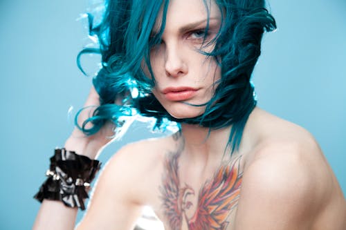 Shirtless Woman with Blue Hair 