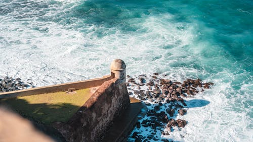 Waves Splashing on Shore with Stone Fort