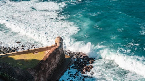 Waves Splashing on Stone Fort Building