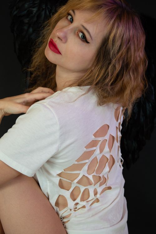 Free Close-up portrait of a woman with unique shirt design, showcasing vibrant style. Stock Photo